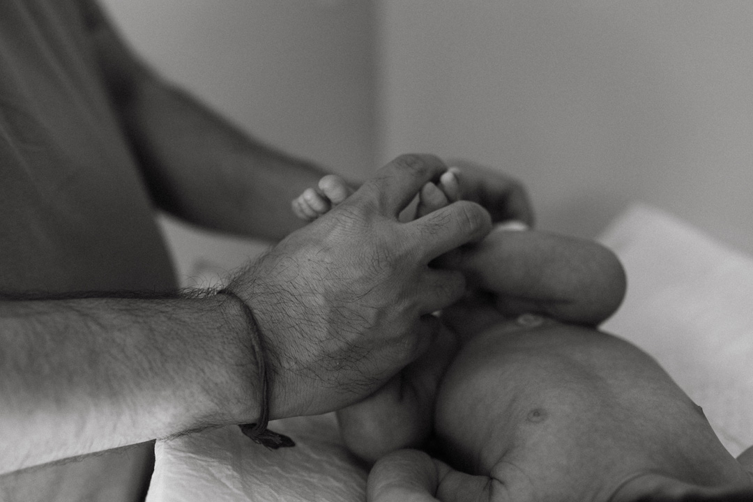 daddy changing baby nappy