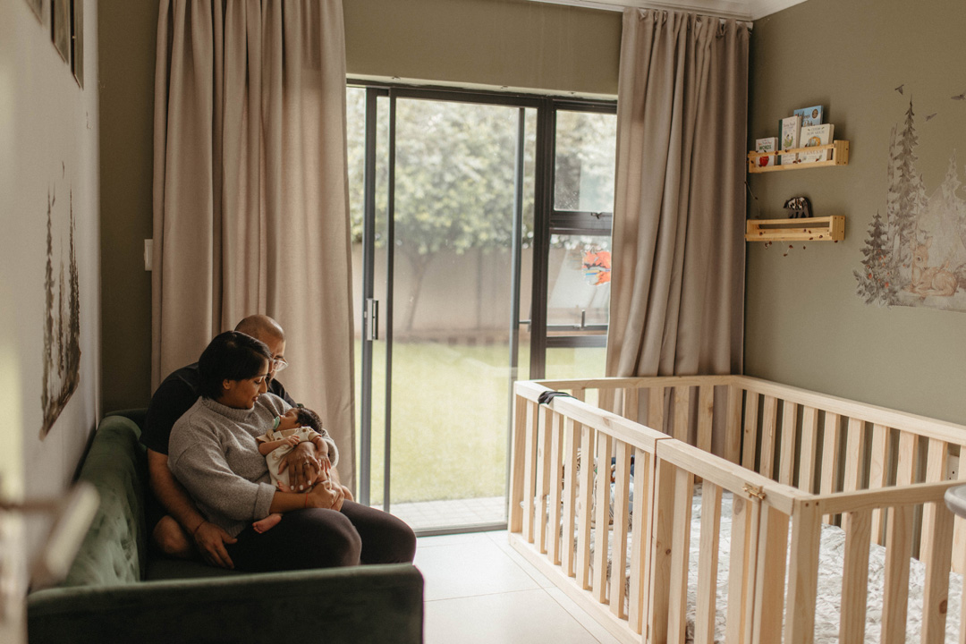 mom and dad in nursery