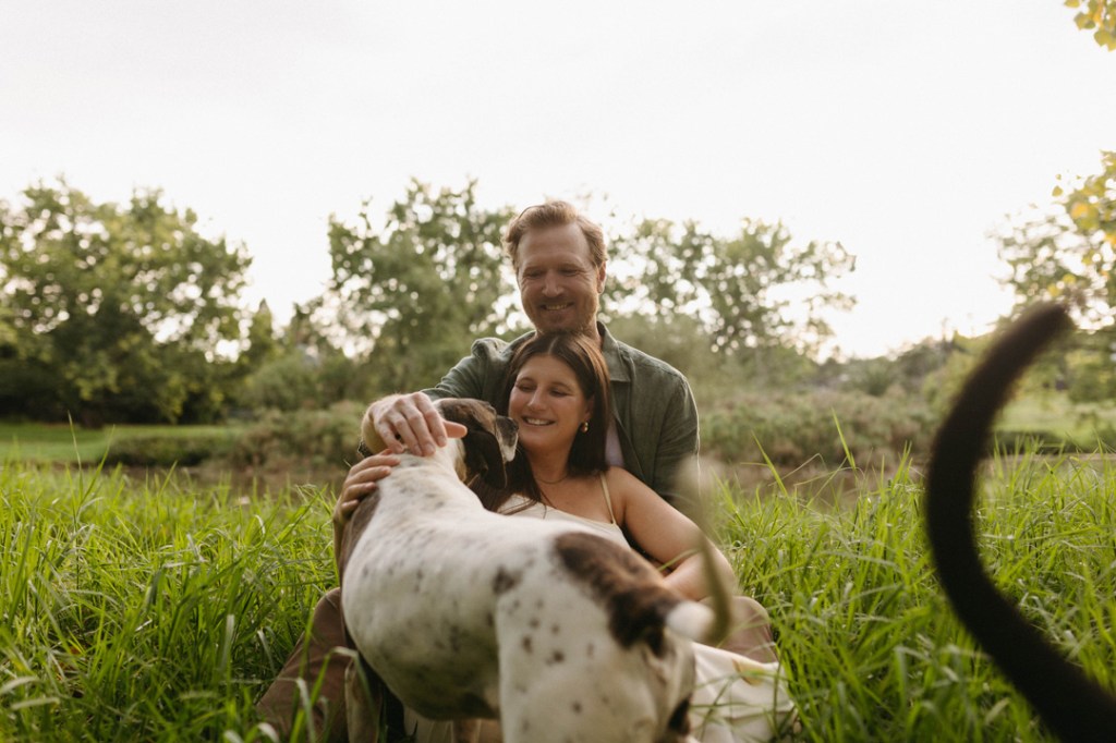 expectant parents and their dogs in a maternity photoshoot