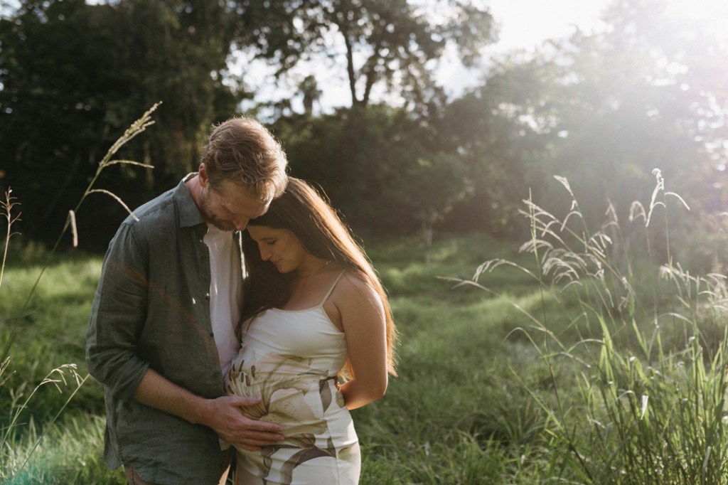a couple sharing an intimate moment during a couple's maternity photoshoot