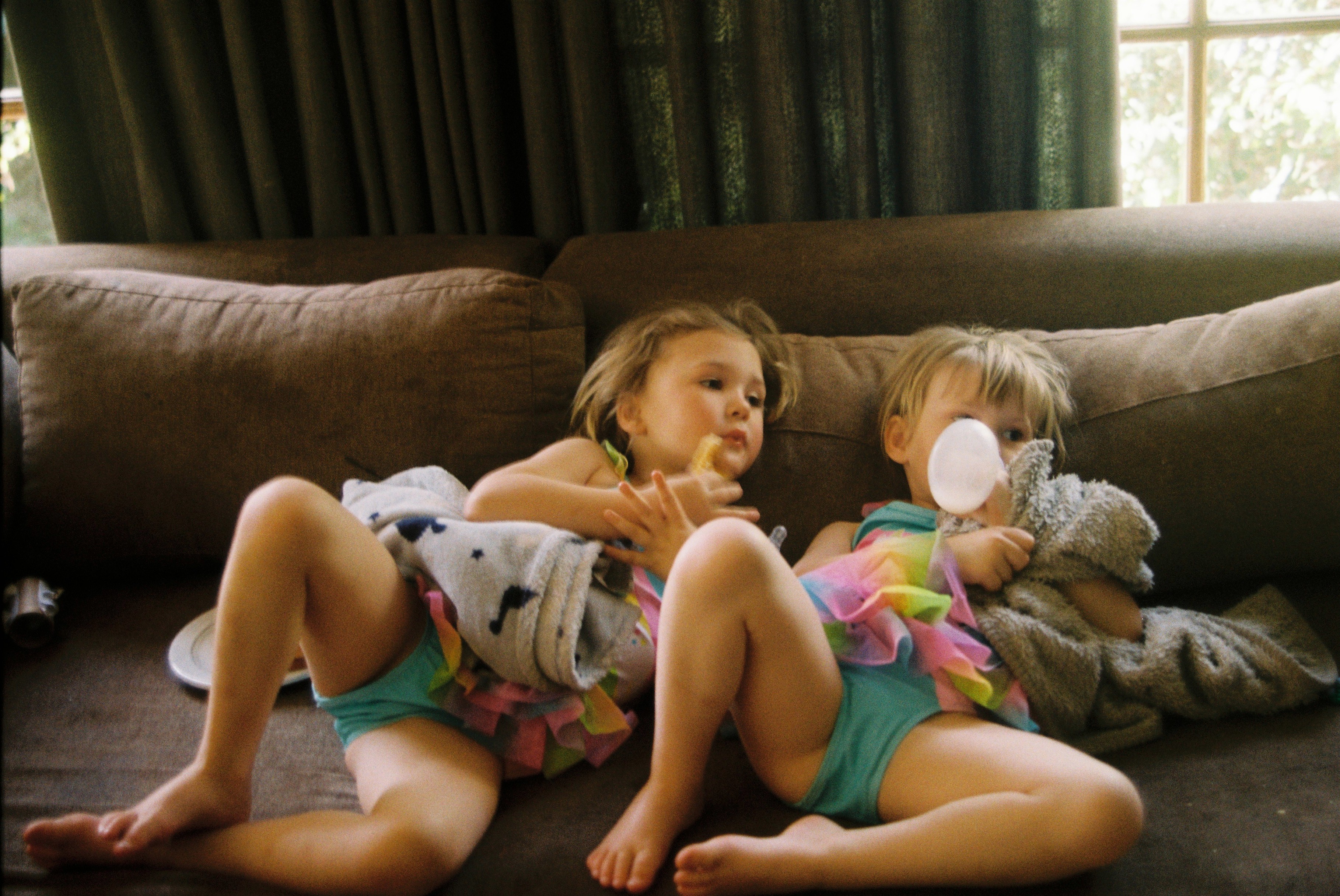 children relaxing on the couch