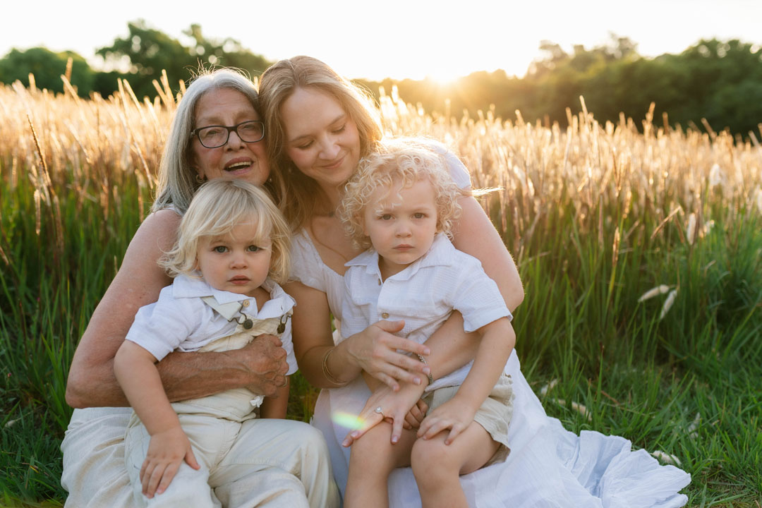 Storytelling photograph of grandmother in beautiful natural light emotive family photoshoot outdoors