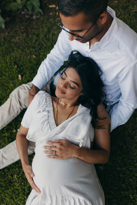 Pregnant mother amongst purple jacaranda blossoms storytelling maternity shoot Johannesburg photographe