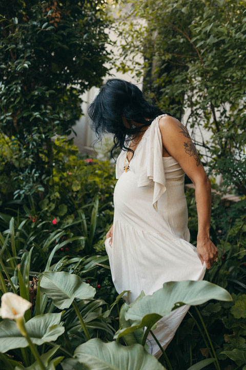 Emotive maternity moment under blooming jacaranda trees golden hour photoshoot Johannesburg by Samantha Steele