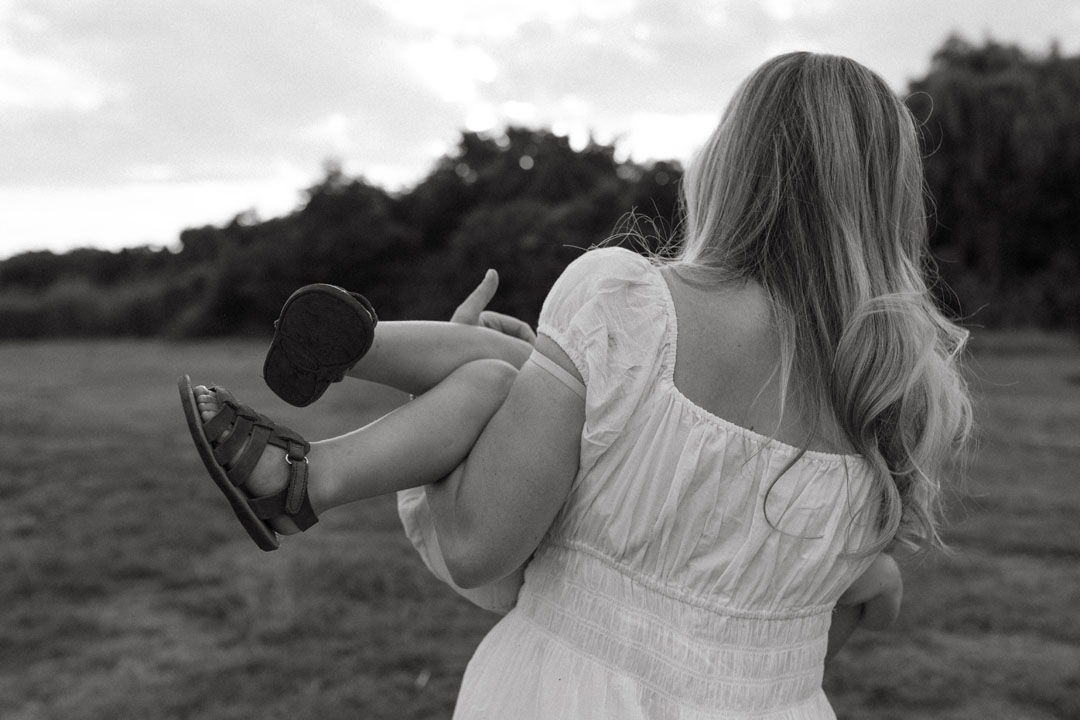 Storytelling photograph of pregnant mother in natural light during emotive photoshoot Johannesburg