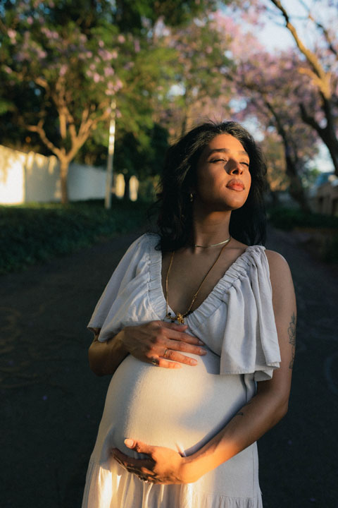 Emotive maternity session captured during jacaranda season natural light photography Johannesburg Gauteng