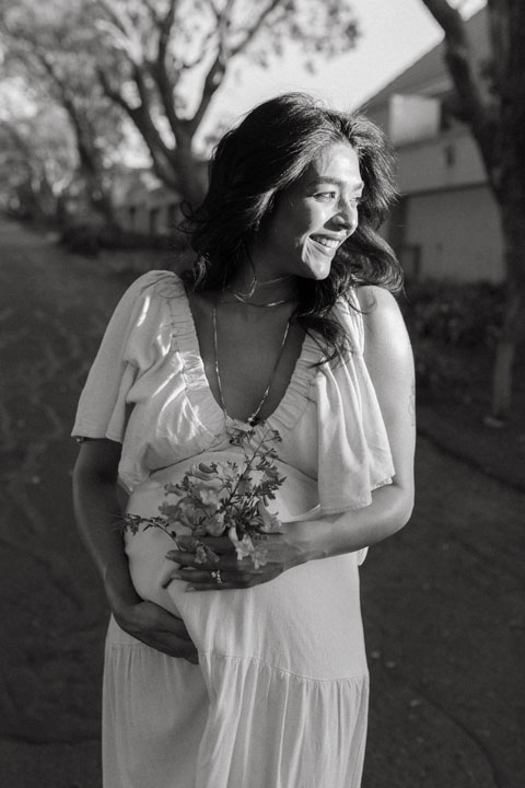 Natural light maternity session amongst jacaranda blossoms emotive pregnancy photography South Africa