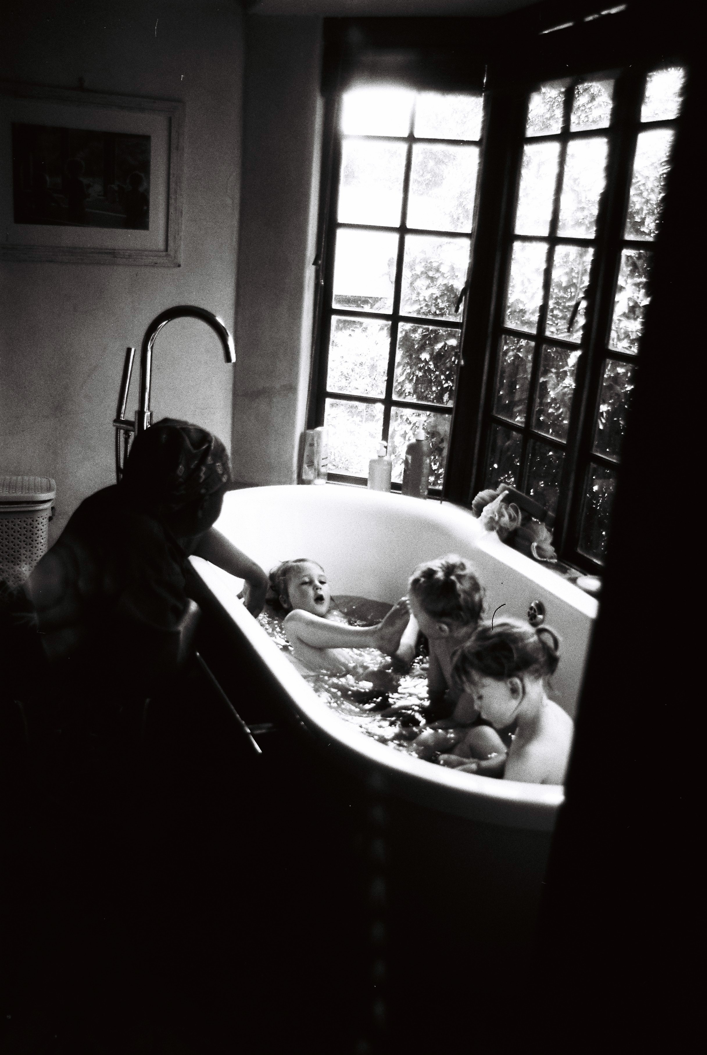 35mm film photography kids in bath during documentary photoshoot