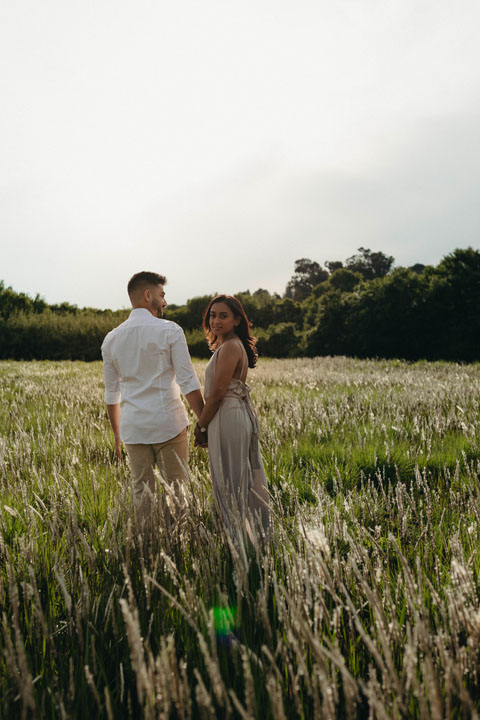 Couple's engagement shoot golden fields